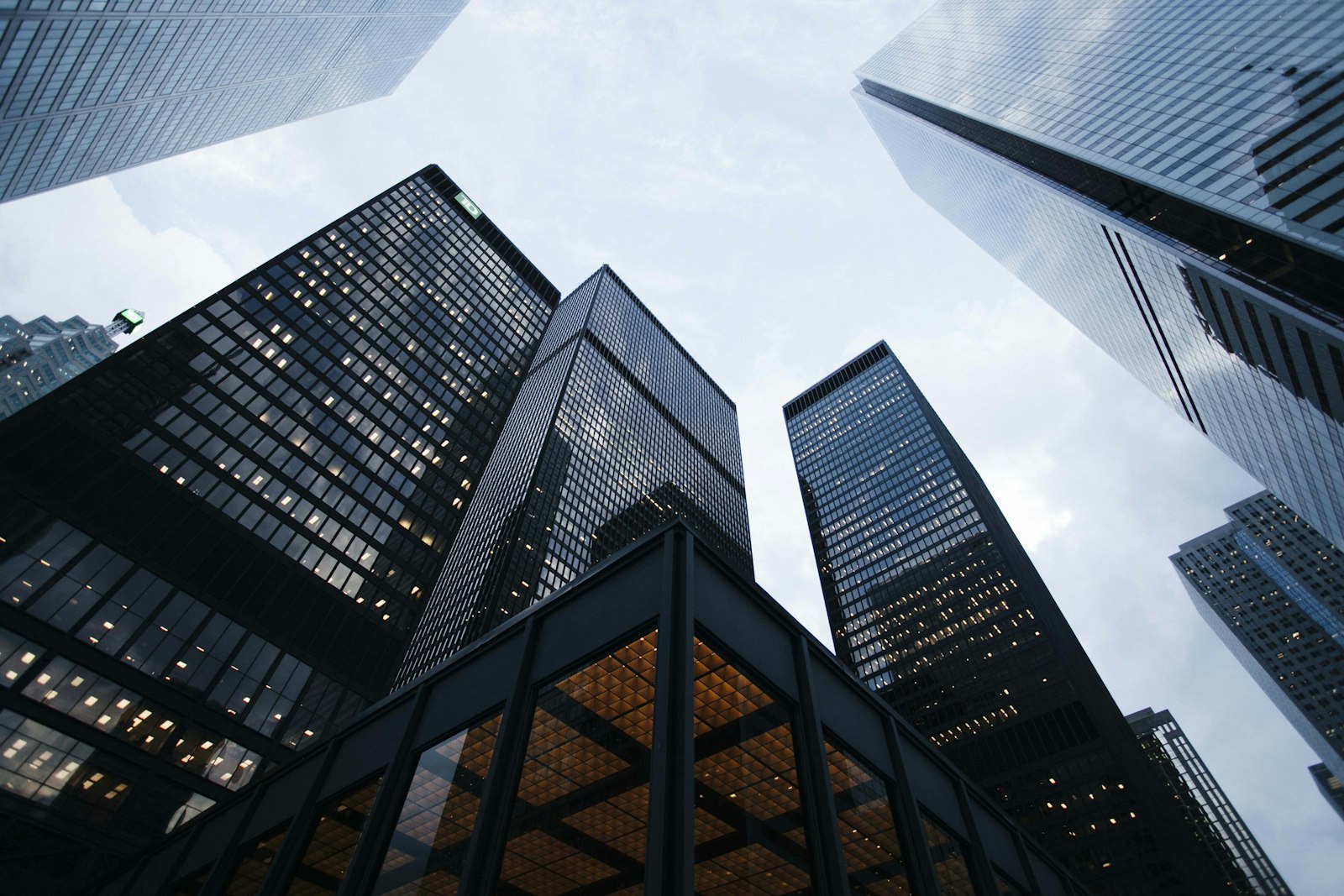 Modern glass commercial towers viewed from below